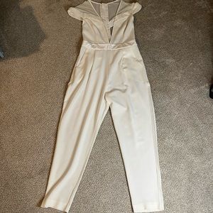ASOS cream/white jumpsuit is size 6. Perfect for bachelorette party!